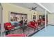 Outdoor lanai featuring tile flooring, multiple seating areas, and views of the pool area at 1878 Killdeer Ct, Venice, FL 34293
