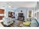 Comfortable living room with vaulted ceilings, large windows, and ample natural light at 1878 Killdeer Ct, Venice, FL 34293