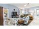 Bright living room with vaulted ceiling, TV, and comfortable seating area at 1878 Killdeer Ct, Venice, FL 34293