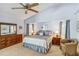Spacious main bedroom with vaulted ceiling, carpeted flooring, sitting area, and ensuite bathroom at 1878 Killdeer Ct, Venice, FL 34293