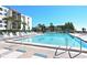 Relaxing swimming pool with inviting lounge chairs and tropical views at 1925 Gulf Of Mexico Dr # G8-206, Longboat Key, FL 34228