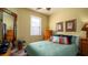 Comfortable bedroom with colorful accents, a queen bed, natural light, and ample storage at 20186 Benissimo Dr, Venice, FL 34293
