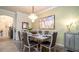 Stylish dining room features modern lighting, elegant decor, and comfortable seating for an enjoyable dining experience at 20186 Benissimo Dr, Venice, FL 34293