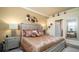 Serene bedroom featuring a luxurious bed, elegant decor, and a relaxing ambiance at 20186 Benissimo Dr, Venice, FL 34293