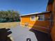 Outdoor patio area for relaxing, featuring concrete pavers and a glimpse of the well-maintained backyard at 22332 Midway Blvd, Port Charlotte, FL 33952