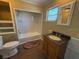 Bathroom featuring a vanity with granite top and a tub with tiled wall at 22332 Midway Blvd, Port Charlotte, FL 33952