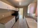 Bright kitchen featuring white cabinets, granite countertops, and stainless steel appliances at 22332 Midway Blvd, Port Charlotte, FL 33952