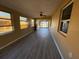 Bright and airy living room features luxury vinyl flooring and large windows at 22332 Midway Blvd, Port Charlotte, FL 33952