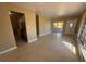 Open living room with visible kitchen and access to the front door and patio at 22332 Midway Blvd, Port Charlotte, FL 33952