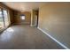 Open living room with neutral carpeting, bright natural light, and easy access to hallways at 22332 Midway Blvd, Port Charlotte, FL 33952
