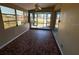 Enclosed patio with multiple windows and tile flooring at 22332 Midway Blvd, Port Charlotte, FL 33952