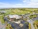 Overhead view of a community clubhouse with parking, pool, and tennis court at 2320 Terra Ceia Bay Blvd # 206, Palmetto, FL 34221