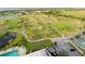 Scenic aerial view of neighborhood golf course, pool, pond and lush surroundings at 2320 Terra Ceia Bay Blvd # 206, Palmetto, FL 34221