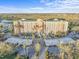 Stunning aerial view of a large condo complex, featuring lush landscaping and convenient covered parking at 2320 Terra Ceia Bay Blvd # 206, Palmetto, FL 34221