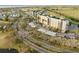Aerial view of waterfront condominium complex with carports, landscaping, and ponds at 2320 Terra Ceia Bay Blvd # 206, Palmetto, FL 34221