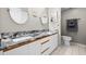 Bathroom with double granite sinks, two mirrors, and a separate water closet at 2320 Terra Ceia Bay Blvd # 206, Palmetto, FL 34221
