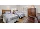 Comfortable bedroom with two twin beds, hardwood floors, an armoire, and natural light at 2320 Terra Ceia Bay Blvd # 206, Palmetto, FL 34221