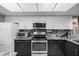 Bright kitchen with stainless steel appliances and sleek granite countertops, offering a modern cooking space at 2320 Terra Ceia Bay Blvd # 206, Palmetto, FL 34221