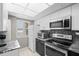 Modern kitchen featuring granite countertops, stainless steel appliances, and ample natural light from the window at 2320 Terra Ceia Bay Blvd # 206, Palmetto, FL 34221
