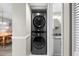 Hallway laundry closet with stackable, stainless steel washer and dryer combo at 2320 Terra Ceia Bay Blvd # 206, Palmetto, FL 34221