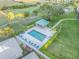 Aerial view of a community pool with ample seating surrounded by manicured landscaping at 2320 Terra Ceia Bay Blvd # 206, Palmetto, FL 34221