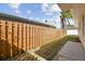 Well-maintained backyard featuring a wood fence, lush grass, and a concrete patio for outdoor enjoyment at 2412 15Th W St, Palmetto, FL 34221