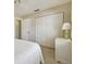 Bedroom with white furniture, carpet flooring, and ample closet space at 2412 15Th W St, Palmetto, FL 34221