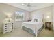 Well-lit bedroom with a large window, neutral tones and comfortable furnishings at 2412 15Th W St, Palmetto, FL 34221