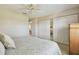 Bright bedroom featuring a ceiling fan and closet with mirrored doors at 2412 15Th W St, Palmetto, FL 34221