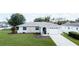 Beautiful one-story home with a well-maintained lawn, attached garage, and manicured landscaping with decorative stone accents at 2412 15Th W St, Palmetto, FL 34221