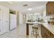 Open concept kitchen with breakfast bar connecting to living area at 2412 15Th W St, Palmetto, FL 34221