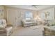 Comfortable living room featuring neutral tones, ample seating, and a large window for natural light at 2412 15Th W St, Palmetto, FL 34221