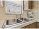 Close up of double sink with chrome fixtures, under window at 2412 15Th W St, Palmetto, FL 34221