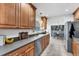 Functional kitchen with wood cabinetry and stainless steel appliances at 2833 Sunnyside St, Sarasota, FL 34239