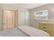 Bedroom featuring a closet and modern dresser, with lots of natural light at 3108 Lake Bayshore Dr # 211, Bradenton, FL 34205
