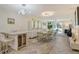 Bright and airy open concept dining and living room with modern decor and herringbone floors at 3108 Lake Bayshore Dr # 211, Bradenton, FL 34205