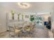 Dining room with modern decor, bright light, and open concept living and dining space with herringbone floors at 3108 Lake Bayshore Dr # 211, Bradenton, FL 34205