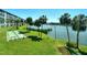 Waterfront community grounds with shuffleboard, lush landscaping, and serene views at 3108 Lake Bayshore Dr # 211, Bradenton, FL 34205