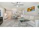 Open-concept living room with modern furnishings and a neutral color palette at 3108 Lake Bayshore Dr # 211, Bradenton, FL 34205