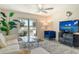 Cozy living room with a large window overlooking the water, comfortable seating, and modern decor at 3108 Lake Bayshore Dr # 211, Bradenton, FL 34205