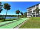 Enjoy outdoor activities with beautiful shuffleboard courts, lakeside views, and lush landscaping at 3108 Lake Bayshore Dr # 211, Bradenton, FL 34205