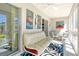 Bright and airy sunroom with comfortable seating and colorful artwork at 3108 Lake Bayshore Dr # 211, Bradenton, FL 34205