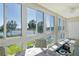 Bright sunroom with floor-to-ceiling windows and lake views at 3108 Lake Bayshore Dr # 211, Bradenton, FL 34205