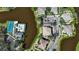 Aerial view showcasing community amenities, including the pool and tennis court near the waterfront homes at 318 108Th St W # 318, Bradenton, FL 34209