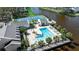 Aerial view of community pool and waterfront offering relaxation and leisure for all residents at 318 108Th St W # 318, Bradenton, FL 34209