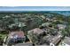 Aerial view of waterfront community with pool, tennis, and parking at 318 108Th St W # 318, Bradenton, FL 34209