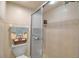 Bathroom featuring a tile shower with sliding doors and decorative accents at 318 108Th St W # 318, Bradenton, FL 34209