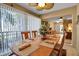 Inviting dining area with views to other living spaces, a large window wall, and seating for six at 318 108Th St W # 318, Bradenton, FL 34209