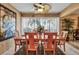 Beautiful dining area with a lovely palm tree view from the window, with a wood table that seats six at 318 108Th St W # 318, Bradenton, FL 34209