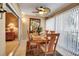 Bright dining space filled with natural light, wood table with seating for six, and direct access to outdoor patio at 318 108Th St W # 318, Bradenton, FL 34209